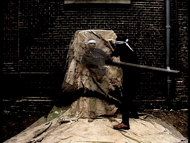 67. Extrait de The Owner, vidéo, 2002 © Goddy Leye